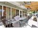 Enclosed patio with various seating options, providing a comfortable outdoor living space at 525 Skylark Nw Ln, Port Charlotte, FL 33952