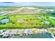 Aerial view of homes along the canal with boat docks and lush greenery at 5253 Boardwalk St, Holiday, FL 34690