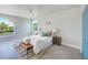 Well-lit bedroom with stylish decor, large windows, and a comfortable seating area at 5253 Boardwalk St, Holiday, FL 34690
