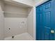 Empty closet with shelf and blue door at 5253 Boardwalk St, Holiday, FL 34690