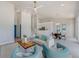 Bright, open-concept living room with modern furnishings and a seamless flow to the kitchen at 5253 Boardwalk St, Holiday, FL 34690