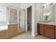 Bright bathroom features a glass shower and double sink vanity for a luxurious space at 5390 Greystone Dr, Spring Hill, FL 34609