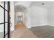 Inviting foyer with tile flooring, arched doorways, and elegant chandelier at 5390 Greystone Dr, Spring Hill, FL 34609