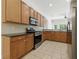 Well-equipped kitchen features stainless steel appliances and ample cabinet space at 5390 Greystone Dr, Spring Hill, FL 34609