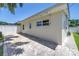 Exterior of home featuring brick patio and views of the privacy-fenced backyard at 5401 7Th N Ave, St Petersburg, FL 33710