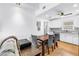 Bright dining area featuring a modern ceiling fan and an adjacent kitchen at 5401 7Th N Ave, St Petersburg, FL 33710
