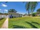 Charming home with a well-maintained front yard and a white privacy fence at 5401 7Th N Ave, St Petersburg, FL 33710