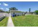 Charming home with a well-maintained front yard and a white privacy fence at 5401 7Th N Ave, St Petersburg, FL 33710
