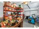 Organized garage with shelving units, storage boxes, and ample space for vehicles and equipment at 5401 7Th N Ave, St Petersburg, FL 33710