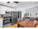 Open kitchen featuring a breakfast area, stainless steel appliances, and a seamless living room flow at 5401 7Th N Ave, St Petersburg, FL 33710