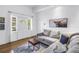 Inviting living room with a comfortable seating area and a bright front door at 5401 7Th N Ave, St Petersburg, FL 33710