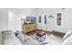 Bright living room with modern decor flows into dining area and features lots of natural light at 5401 7Th N Ave, St Petersburg, FL 33710
