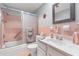Bathroom featuring a shower over tub and tiled walls at 6000 20Th N St # 123, St Petersburg, FL 33714