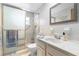 Bright bathroom features tiled shower, updated sink, and neutral color palette at 6000 20Th N St # 123, St Petersburg, FL 33714