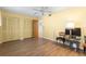 Bedroom features wood flooring, closet, and a ceiling fan at 6000 20Th N St # 123, St Petersburg, FL 33714