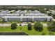 Exterior building view of the condos with mature landscaping and a manicured lawn at 6000 20Th N St # 123, St Petersburg, FL 33714