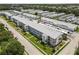 An exterior shot of the condo building with well-maintained landscaping and carports at 6000 20Th N St # 123, St Petersburg, FL 33714