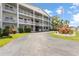 Exterior of condo featuring manicured landscaping and circle driveway at 6000 20Th N St # 123, St Petersburg, FL 33714