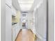 The compact kitchen features white cabinets and plenty of sunlight at 6000 20Th N St # 123, St Petersburg, FL 33714