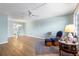 The living room features wood-look flooring and a ceiling fan at 6000 20Th N St # 123, St Petersburg, FL 33714