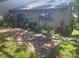 Private backyard featuring a brick-paved patio surrounded by greenery at 6262 142 N Ave # 1001, Clearwater, FL 33760