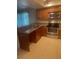 Modern kitchen features tile floors, stainless steel appliances and granite countertops and ample cabinet space at 6262 142 N Ave # 1001, Clearwater, FL 33760