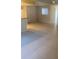 Bright and spacious living room with tile floors and natural light from large windows at 6262 142 N Ave # 1001, Clearwater, FL 33760