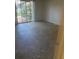 Spacious living room with sliding glass doors at 6262 142 N Ave # 1001, Clearwater, FL 33760