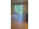 Bright living area featuring a sliding glass door and tiled floors at 6262 142 N Ave # 1001, Clearwater, FL 33760