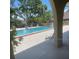 Exterior image showcasing a refreshing community pool surrounded by lush landscaping at 6262 142 N Ave # 1001, Clearwater, FL 33760