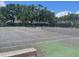 Image showcasing well-maintained tennis courts surrounded by lush landscaping at 6262 142 N Ave # 1001, Clearwater, FL 33760