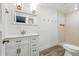 Bathroom with updated white vanity, mirror and walk-in shower at 6301 Hobson Ne St, St Petersburg, FL 33702