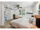 Bright bedroom with wood floors, sliding glass door, ceiling fan, and a modern design at 6301 Hobson Ne St, St Petersburg, FL 33702