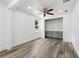 Walk-in closet with custom shelves and wood-look tile flooring at 6301 Hobson Ne St, St Petersburg, FL 33702