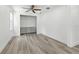 Walk-in closet with custom shelves and wood-look tile flooring at 6301 Hobson Ne St, St Petersburg, FL 33702