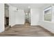 Hallway with updated flooring that connects the living room and kitchen at 6301 Hobson Ne St, St Petersburg, FL 33702