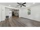 Spacious living room with hardwood floors and views of the bright and modern kitchen at 6301 Hobson Ne St, St Petersburg, FL 33702