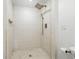 Walk-in shower features white subway tile and a rainfall shower head at 6301 Hobson Ne St, St Petersburg, FL 33702