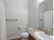 Clean bathroom with a granite vanity, white toilet, and shower with white curtain at 7001 Interbay Blvd # 219, Tampa, FL 33616