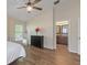 Bedroom with wood floors, a ceiling fan, and an ensuite bathroom at 7001 Interbay Blvd # 219, Tampa, FL 33616