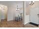 Open dining area with updated lighting and hardwood floors at 7001 Interbay Blvd # 219, Tampa, FL 33616