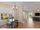Inviting dining area with wood floors and view into the living room at 7001 Interbay Blvd # 219, Tampa, FL 33616