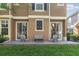 Townhouse featuring a quaint back patio and a manicured lawn, perfect for outdoor enjoyment at 7001 Interbay Blvd # 219, Tampa, FL 33616