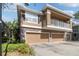 Charming townhome with a two-car garage, balcony, and stone accents at 7001 Interbay Blvd # 219, Tampa, FL 33616