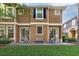 Townhouse with a quaint back patio and manicured lawn, perfect for enjoying the outdoors at 7001 Interbay Blvd # 219, Tampa, FL 33616