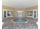 Indoor hot tub surrounded by windows and a covered patio at 7001 Interbay Blvd # 219, Tampa, FL 33616