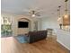 Bright living room featuring wood floors, ceiling fan, and sliding glass doors to the patio at 7001 Interbay Blvd # 219, Tampa, FL 33616