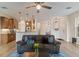 Stylish living room with updated lighting, hardwood floors, and an open floor plan at 7001 Interbay Blvd # 219, Tampa, FL 33616