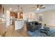 Cozy living room with wood floors, ceiling fan, and stainless steel appliances at 7001 Interbay Blvd # 219, Tampa, FL 33616