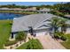 An attractive single Gathering home with a brick driveway, attached garage, overlooking a serene pond in a well-maintained neighborhood at 717 Manchester Woods Dr # 717, Sun City Center, FL 33573